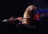 Pamela Copus of the group 2002 playing flute