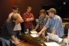 The Speed Of Bluegrass brain trust plotting their strategy in the studio
