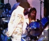 Elvis Presley with TCB Band Drummer Ronnie Tutt performing on the Aloha From Hawaii Concert in 1973.